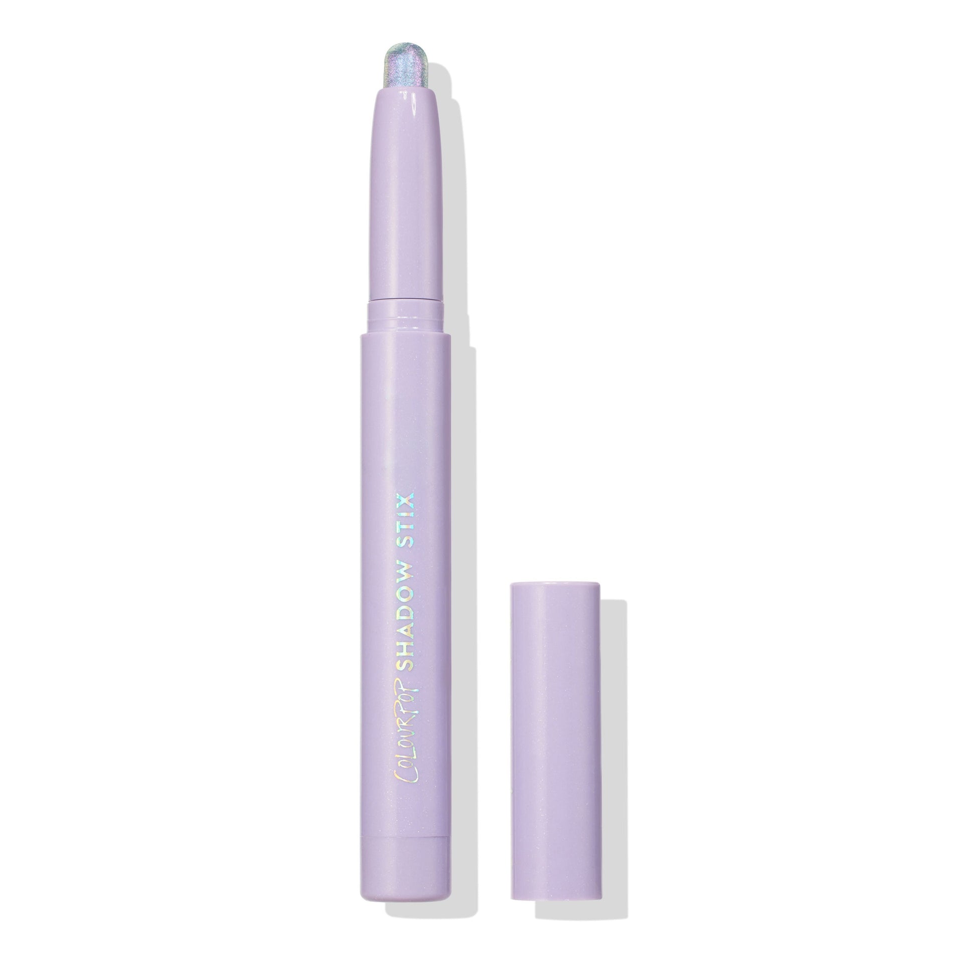 Colourpop Cotton Candy Shadow Stix shown uncapped on a white background, featuring a pastel lavender tube with holographic “Colourpop Shadow Stix” logo and a shimmering iridescent cream eyeshadow tip.