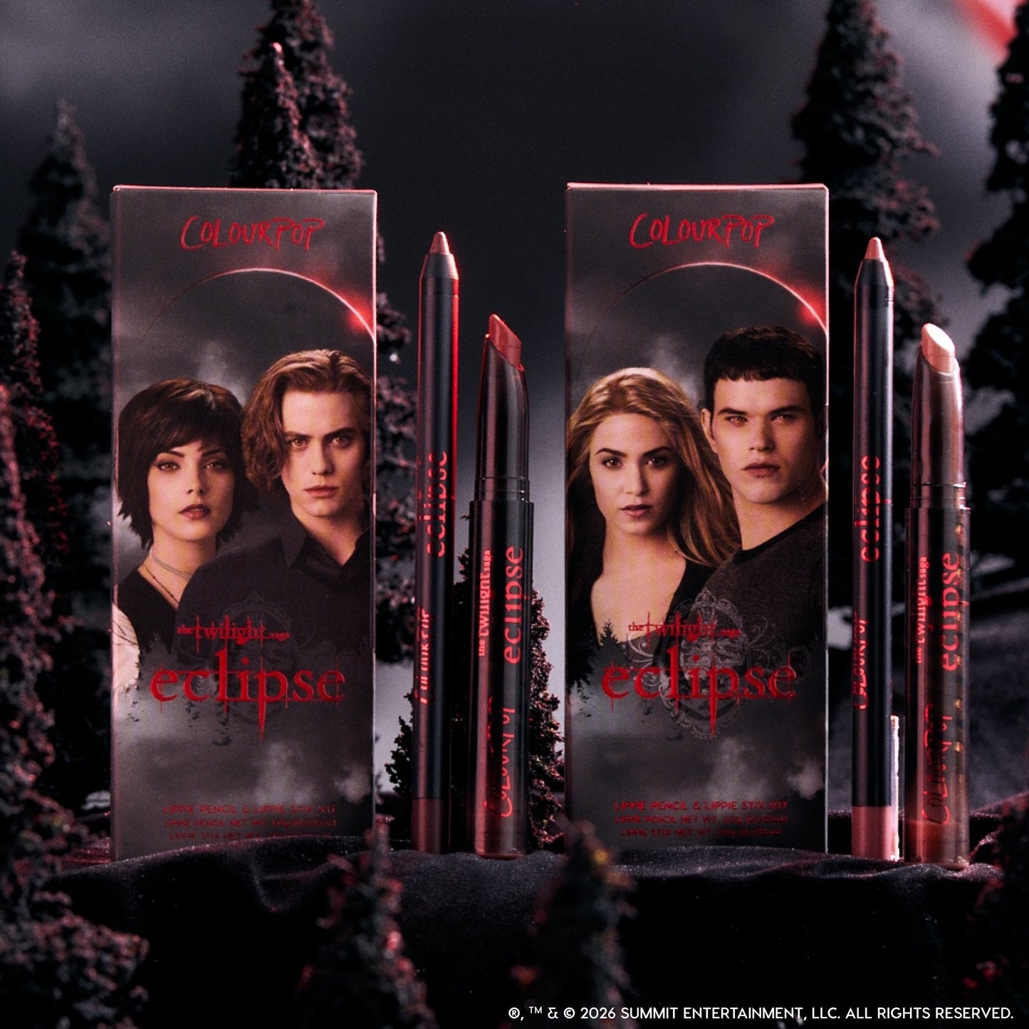 ColourPop Immortal Kiss Lippie Stix Duo from the Twilight Eclipse collection standing between two character-adorned boxes, with vampy red and nude lip shades styled in a dark, misty forest backdrop for dramatic makeup lovers.